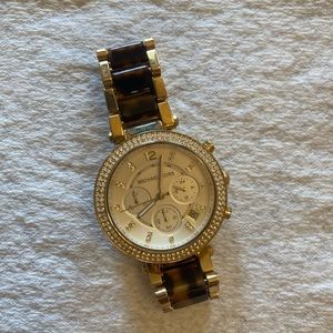 Michael Kors faux diamond bezel women’s watch.